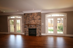 double french doors and cultured stone fireplace