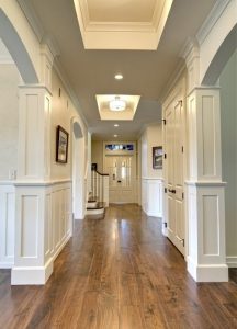 Hallway with wainscoting and columns